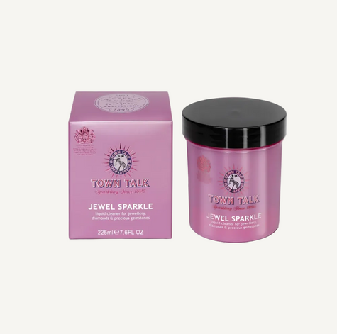 Town Talk Jewelry Sparkle liquid acrylic for jewellery in a pink jar with a black lid next to its matching pink box, on a white background.